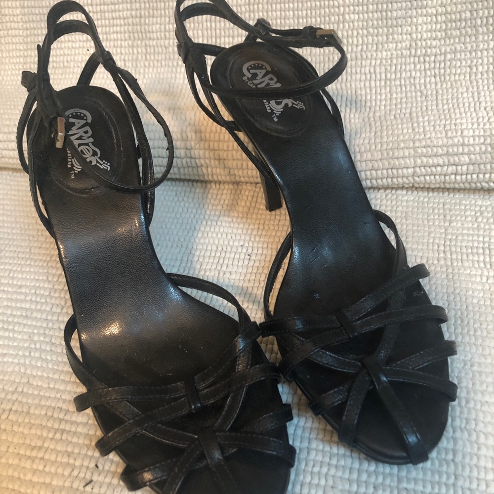 Woman’s black open toed high heel shoes